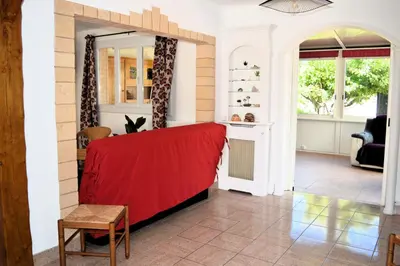 Coin salon dans l'établissement Le Caprice de la mer - maison avec véranda, jardin