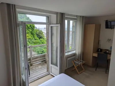 Un ou plusieurs lits dans un hébergement de l'établissement Chambres Breizh Café