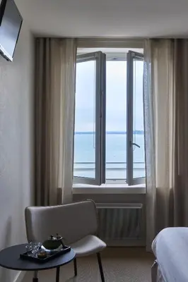 Un ou plusieurs lits dans un hébergement de l'établissement Chambres Breizh Café