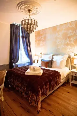 Un ou plusieurs lits dans un hébergement de l'établissement Villa Victoria Hôtel et Spa