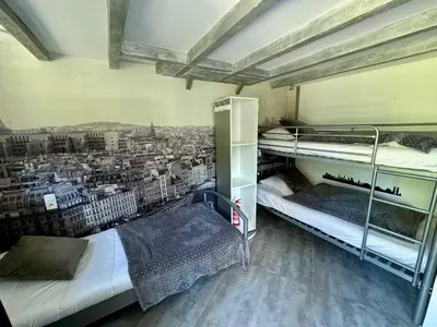 Un ou plusieurs lits dans un hébergement de l'établissement La Clef Decamp Moulin du Gast 35pers jacuzzi sauna billard baby