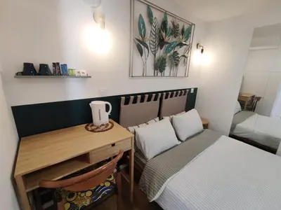 Un ou plusieurs lits dans un hébergement de l'établissement Suite parentale indépendante en ville - chez l'habitant