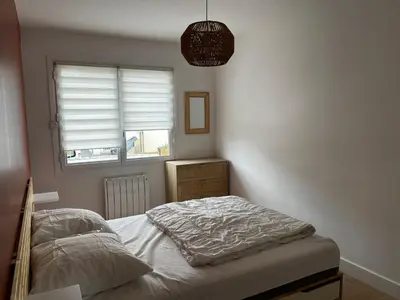 Un ou plusieurs lits dans un hébergement de l'établissement Appartement Granville