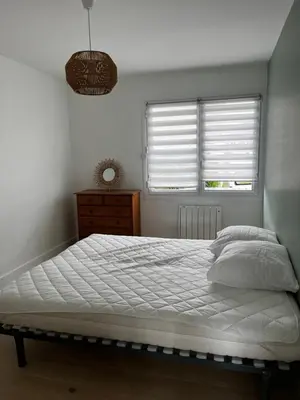 Un ou plusieurs lits dans un hébergement de l'établissement Appartement Granville