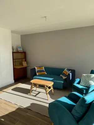 Coin salon dans l'établissement Appartement Granville