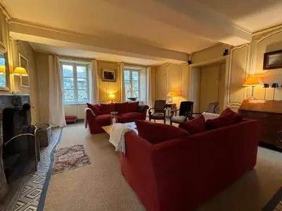 Coin salon dans l'établissement Belle maison de famille