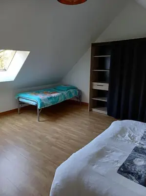 Un ou plusieurs lits dans un hébergement de l'établissement Maison au calme bord de mer