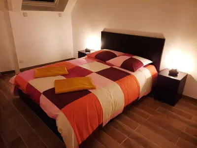 Un ou plusieurs lits dans un hébergement de l'établissement Duplex avec vue sur mer-La Rose des Vents