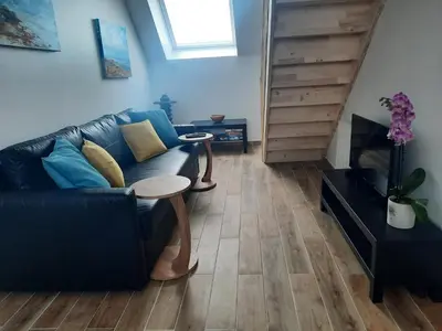 Coin salon dans l'établissement Duplex avec vue sur mer-La Rose des Vents