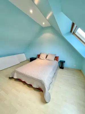 Un ou plusieurs lits dans un hébergement de l'établissement Maison de campagne à la mer