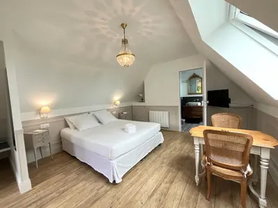 Un ou plusieurs lits dans un hébergement de l'établissement La Chambre du Cottage B&B