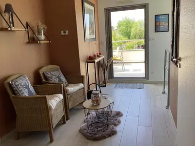 Coin salon dans l'établissement Sallenelles Face à la baie