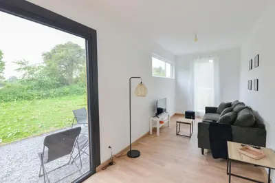 Coin salon dans l'établissement Le Normandy - Sauna - A moins de 2 km de la plage