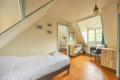 Un ou plusieurs lits dans un hébergement de l'établissement Les Colibris maison en centre-ville