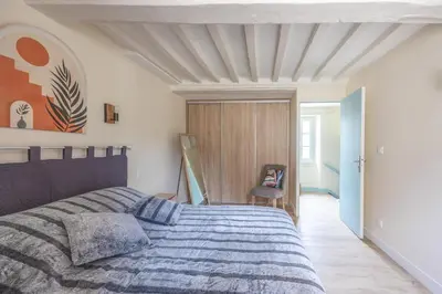 Un ou plusieurs lits dans un hébergement de l'établissement Les Colibris maison en centre-ville