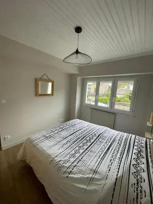 Un ou plusieurs lits dans un hébergement de l'établissement Appartement à 100m de la plage