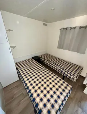 Un ou plusieurs lits dans un hébergement de l'établissement Mobilhome moderne avec grande terrasse, pergola, HUDIMESNIL