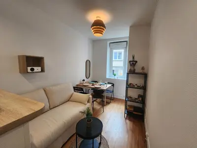 Coin salon dans l'établissement Le Cocon du Château - Appt 4pers - Hypercentre