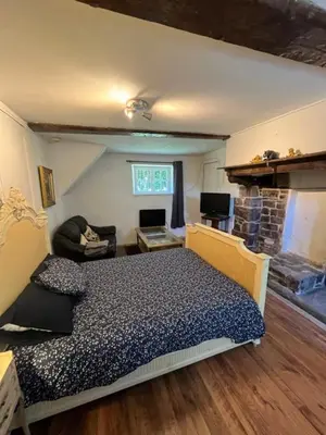 Un ou plusieurs lits dans un hébergement de l'établissement chambre d'hote a la ferme