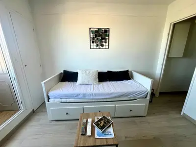 Un ou plusieurs lits dans un hébergement de l'établissement L'Escale - Studio avec loggia en centre ville