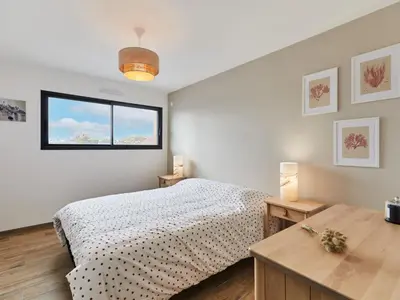 Un ou plusieurs lits dans un hébergement de l'établissement Holiday Home Les lilas by Interhome