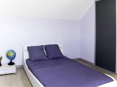 Un ou plusieurs lits dans un hébergement de l'établissement Holiday Home les Dunes du Havre by Interhome