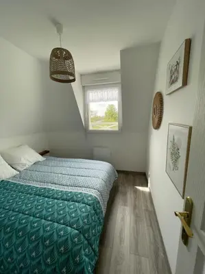 Un ou plusieurs lits dans un hébergement de l'établissement Les Belles Rives T2 avec balcon ensoleillé