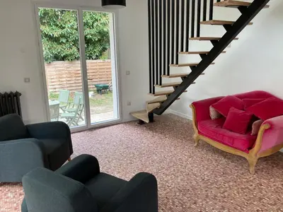 Coin salon dans l'établissement Villa très proche de la plage