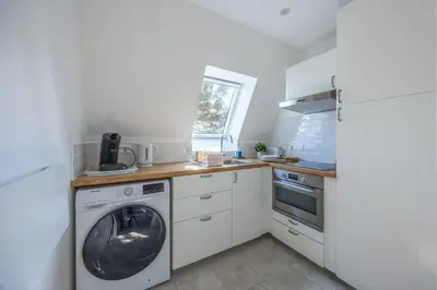 Cuisine ou kitchenette dans l'établissement Duplex Les Mouettes - Welkeys
