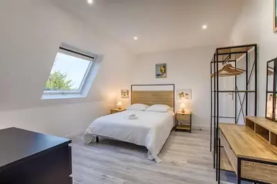 Un ou plusieurs lits dans un hébergement de l'établissement Bel Appartement Cabourg
