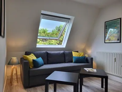 Coin salon dans l'établissement Bel Appartement Cabourg