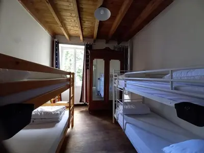 Un ou plusieurs lits dans un hébergement de l'établissement maison Andrew TUCK III