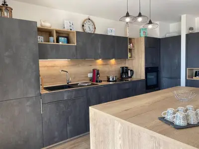 Cuisine ou kitchenette dans l'établissement L'Abri Côtier