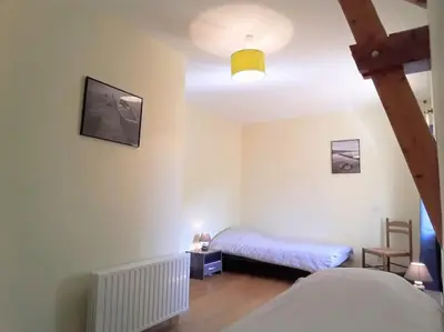 Un ou plusieurs lits dans un hébergement de l'établissement Holydays House, maison en Normandie, Manche,