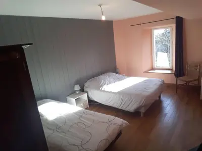 Un ou plusieurs lits dans un hébergement de l'établissement Holydays House, maison en Normandie, Manche,