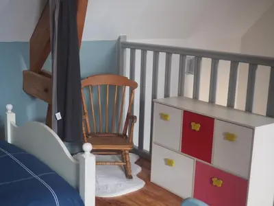 Un ou plusieurs lits dans un hébergement de l'établissement Gite de la petite maison