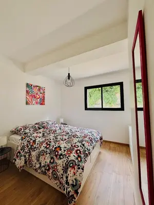 Un ou plusieurs lits dans un hébergement de l'établissement Maison Privée, Calme, parking, Jardin