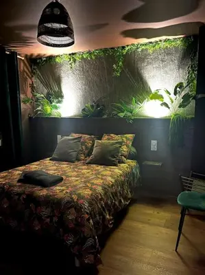 Un ou plusieurs lits dans un hébergement de l'établissement La cabane tropicale