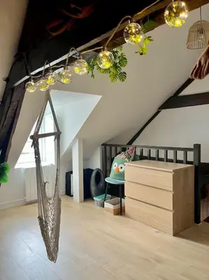 Un ou plusieurs lits dans un hébergement de l'établissement La cabane tropicale