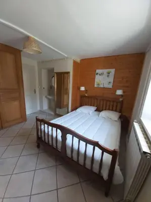 Un ou plusieurs lits dans un hébergement de l'établissement Gîte en pleine nature