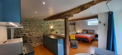 Un ou plusieurs lits dans un hébergement de l'établissement Les gîtes de La Petite Taupe - Studio Jo