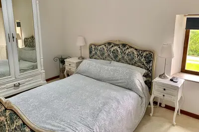 Un ou plusieurs lits dans un hébergement de l'établissement Le Pressoir de la Vieville, Gite Renoir
