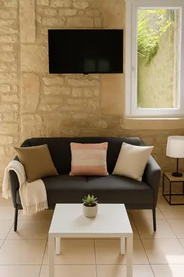 Télévision ou salle de divertissement dans l'établissement Le Nid d Abbaye