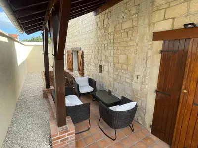 Coin salon dans l'établissement Gesse, Maison avec terrasse