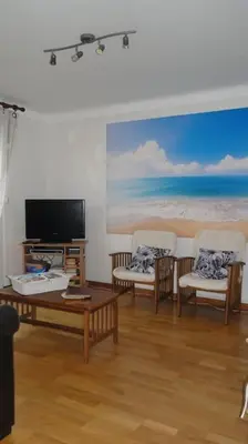 Télévision ou salle de divertissement dans l'établissement FRONT DE MER, meublé de tourisme sur le port