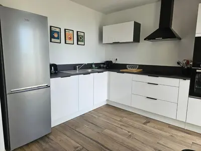 Cuisine ou kitchenette dans l'établissement Entre ciel et mer