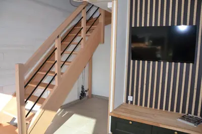 Télévision ou salle de divertissement dans l'établissement Les Marais Blancs à Picauville