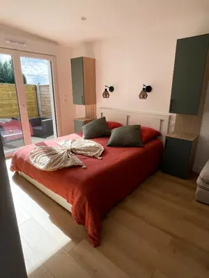 Un ou plusieurs lits dans un hébergement de l'établissement Studio moderne - BELLE AURA