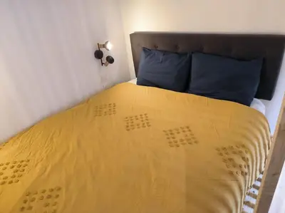 Un ou plusieurs lits dans un hébergement de l'établissement Studio à 100 m de la plage PIQUOT 44