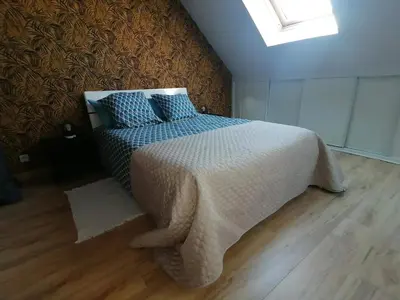 Un ou plusieurs lits dans un hébergement de l'établissement Maison champêtre à Gavray-sur-Sienne avec jardin clôturé